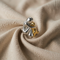 Open ring with embrace and cubic zirconia setting