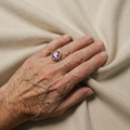 White Gold Ring Featuring Pear-Shaped Pink Sapphire on Silver Band