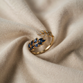 Gold-coloured Ring with blue leaves and zirconia