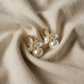 Elegant pearl earrings with flowers