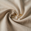 Elegant, handmade gold earrings with pearl