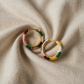 Hana – Gold Earrings in a short style.