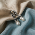 Silver earrings with lily and pearl, press mould type