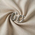 Justina – Silver-Coloured Twisted Hoops