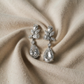 White gold earrings with flower-shaped drop