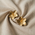 Gold-coloured five-petal flower earrings