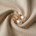 Vintage-style earrings with gold wire pearls