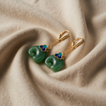 Green earrings with elephant and blue flower