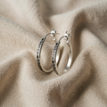 Silver-coloured earrings with leaf pattern