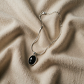 Elegant black oval necklace in white gold