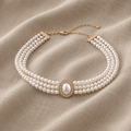 Elegant pearl necklace with three strands