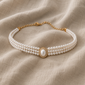 Elegant pearl choker with three strands