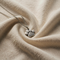 Elegant paw print pendant – made of stainless steel