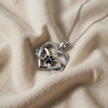 Necklace with heart and paw print pendant