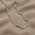 Necklace with Twisted Wave Pattern in White Gold