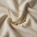 Stylised Gold Dog Pendant with Short Legs and Smooth Surface