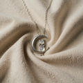 Necklace with moon and opal-effect cat