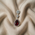 Necklace with teardrop ruby and cubic zirconia
