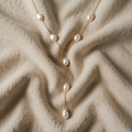 Gold-coloured necklace with pearl effect Y pendant