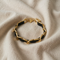 Elina – gold-coloured bracelet with chain links and black
