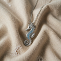 Silver watch with seahorse and opal