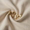 Gold-coloured double heart design earrings