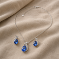 Set with silver-coloured blue drop motif