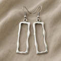 Silver-Tone Earrings with Irregular Hooks